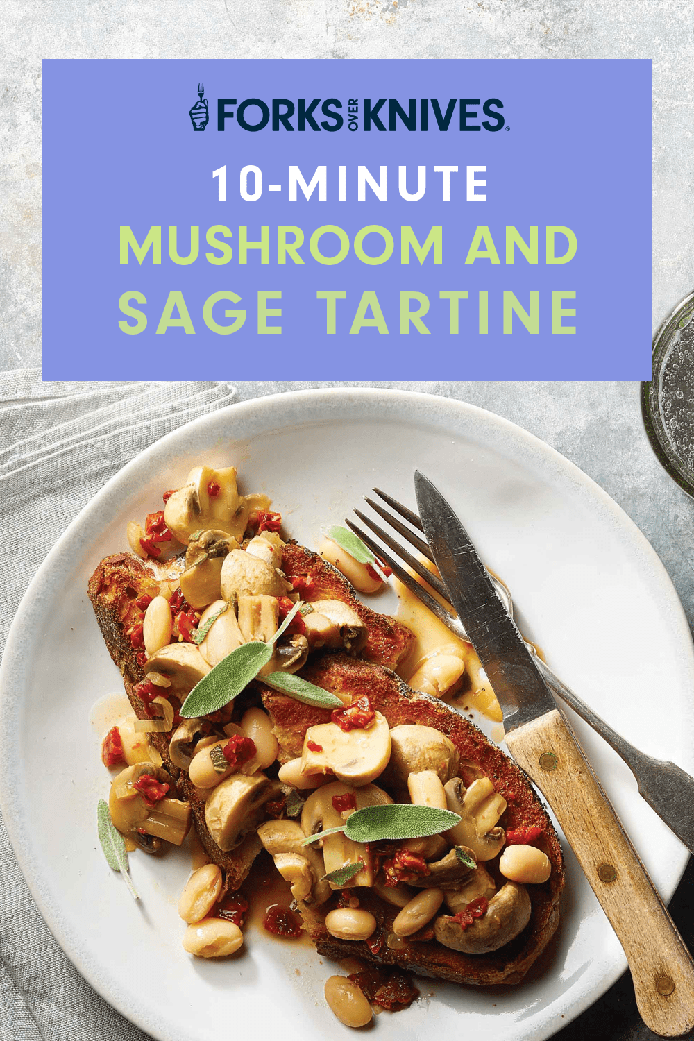 Two pieces of toast on a white plate. Each piece is topped with a mix of beans and mushrooms, and a garnish of fresh sage. The title reads, "10-Minute Sage and Mushroom Tartine"