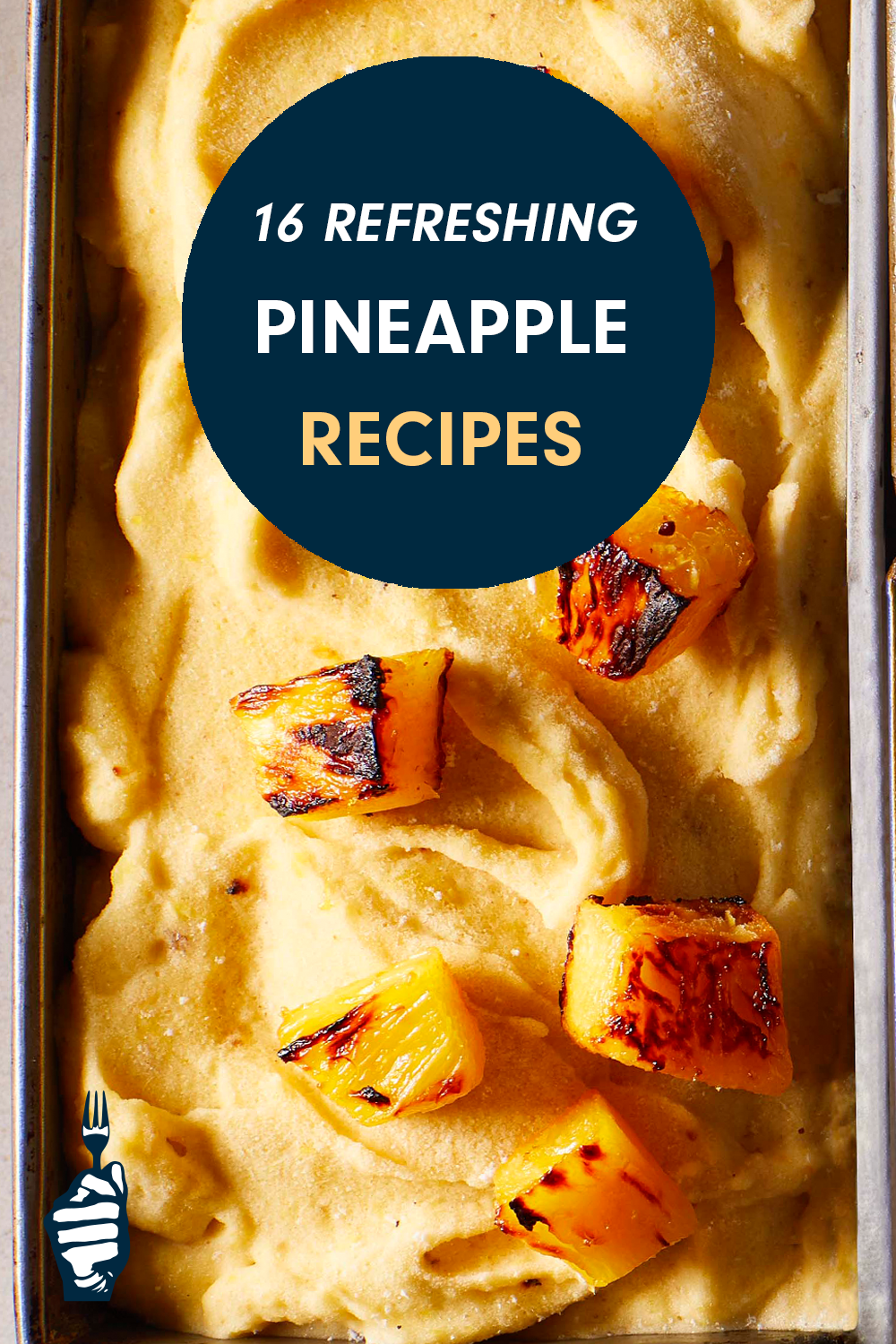 A loaf tin of yellow-hued pineapple ice cream topped with caramelized chunks of pineapple. Text reads, "16 Refreshing Pineapple Recipes to Bring a Taste of the Tropics to Your Plate"