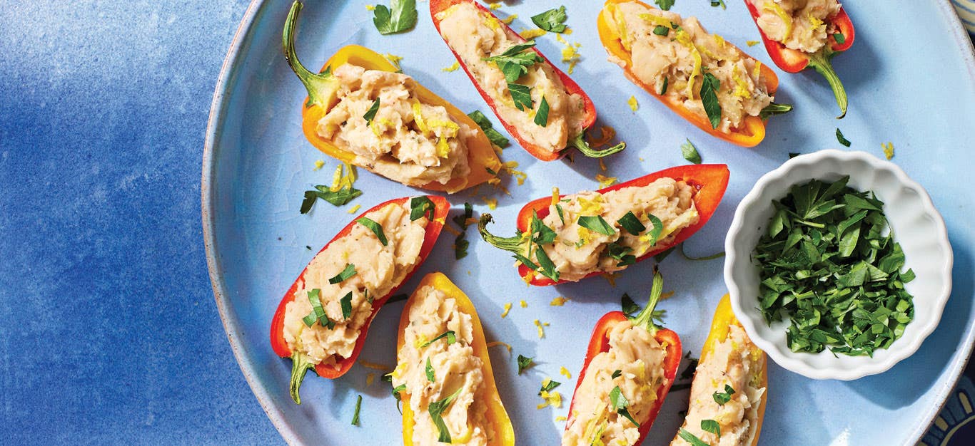 Greek Stuffed Mini Peppers on a light blue ceramic plate