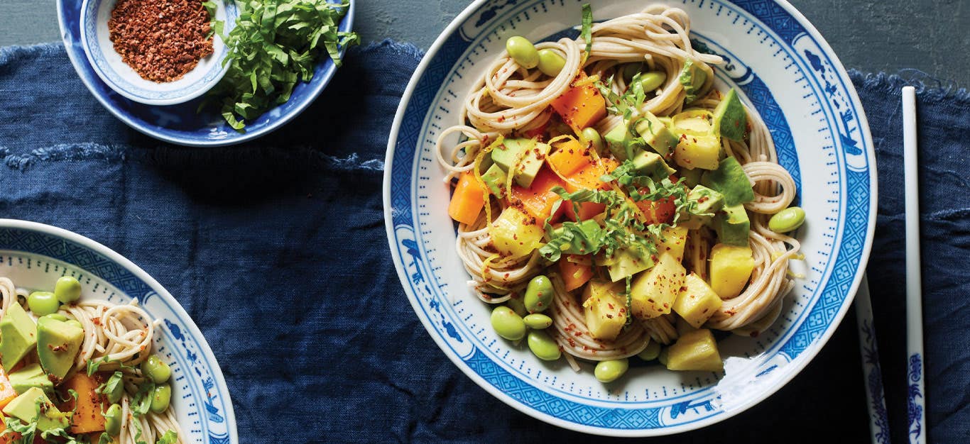 Tropical Soba Noodle Bowls in white and blue china bowls with chopsticks on a blue tablecloth