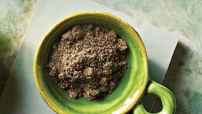 A rustic vibrant green bowl of chia with water added