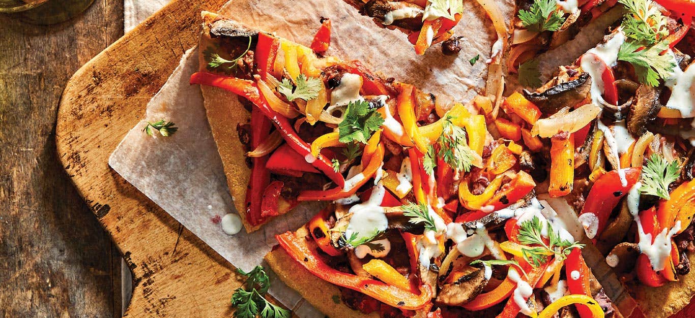 Fajita Pizza on a wooden cutting board