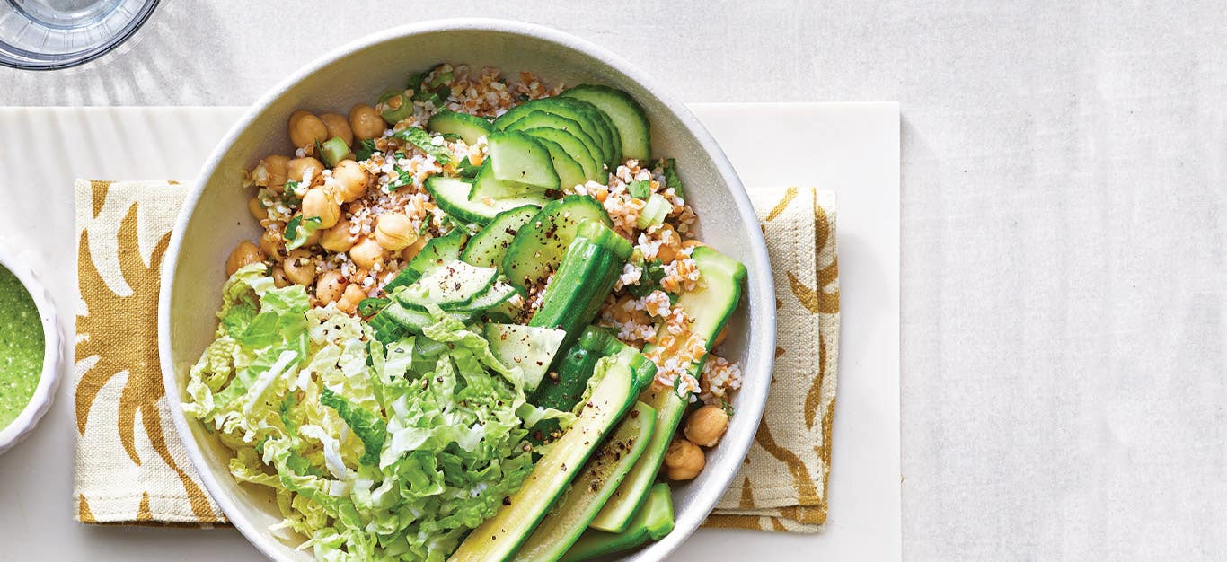 Super Green Goddess Bulgur Bowl in a white ceramic bowl against a white countertop