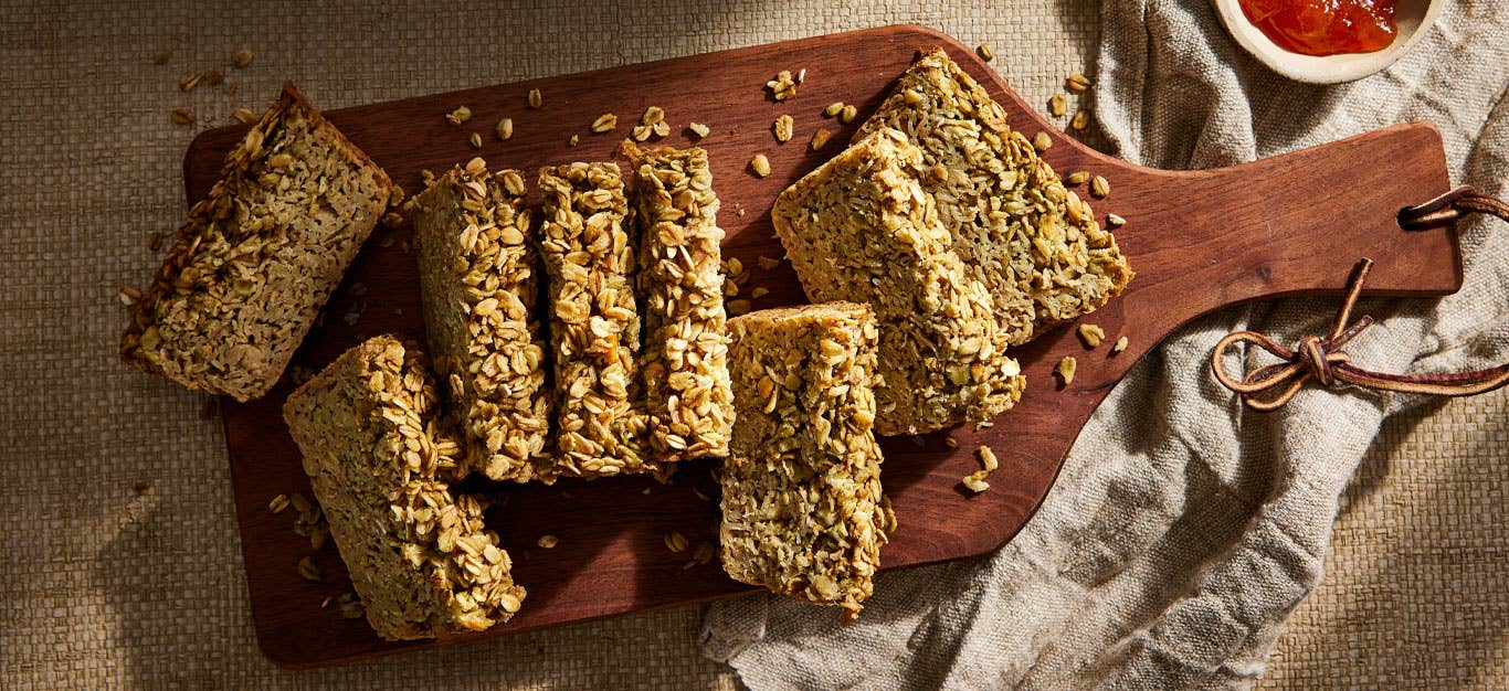 Irish Porridge Bread on a wooden paddle cutting board