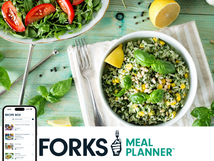 A table set with with a grain bowl and fork on a placemat next to a bowl of arugula and tomato slices, with "Forks Meal Planner" and a picture of the meal planner app, pictured below