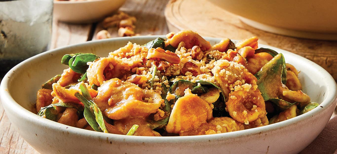 Orecchiette with Creamy Vegan Tomato Sauce in a white ceramic bowl