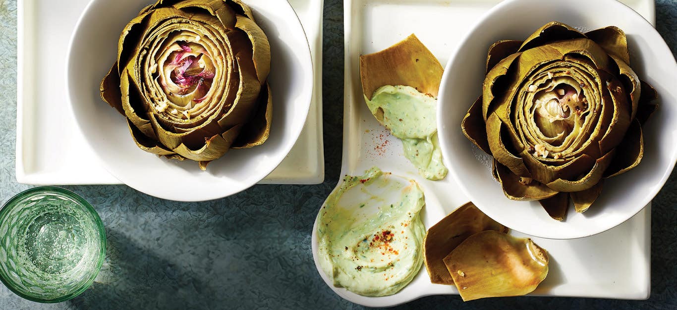 Instant Pot Artichokes with Lemony Vegan Aioli in white ceramic bowls