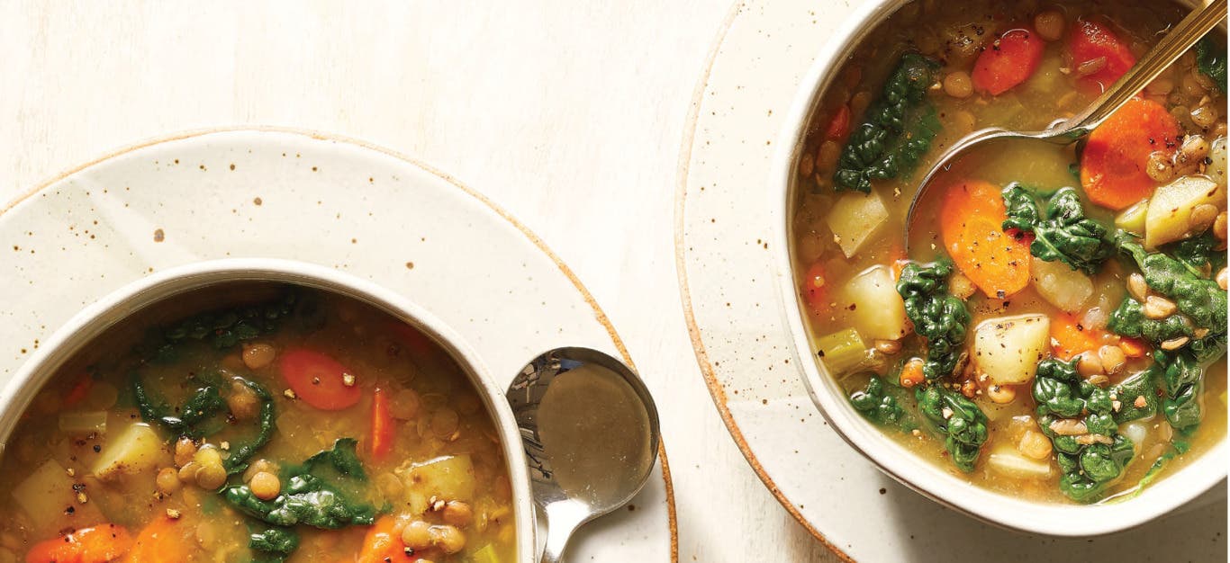 Two bowls of 8-Ingredient Lentil Soup with Potatoes and Kale