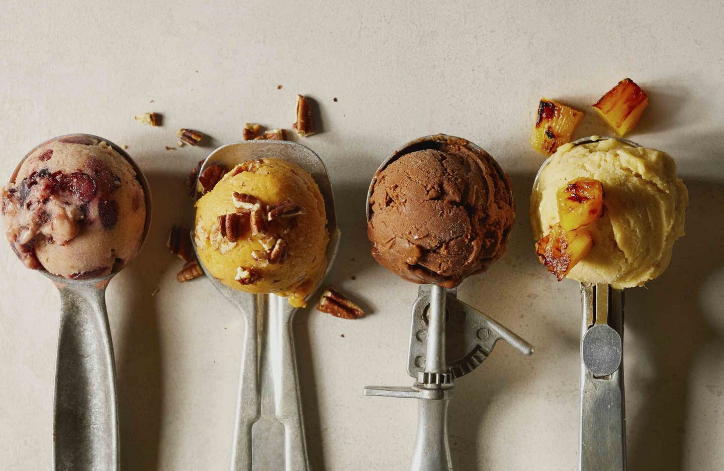 Four ice cream scoops with different flavors of healthy vegan ice cream