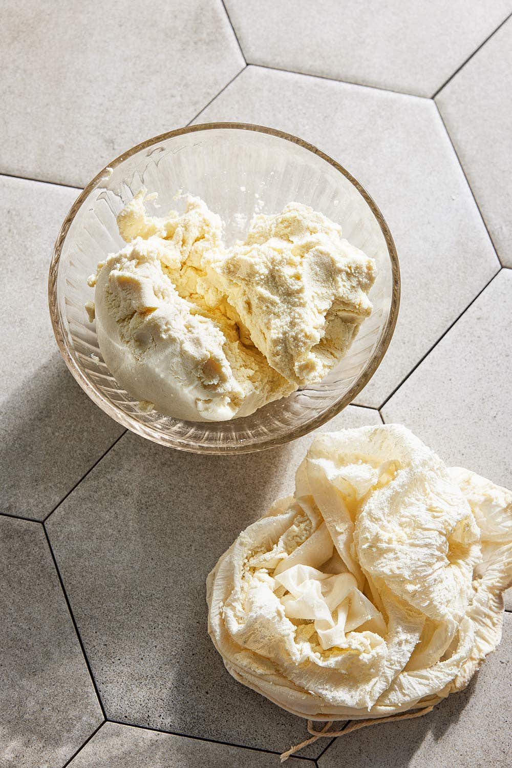 Soaked and blended soy beans in a glass bowl before being squeezed in a nut bag to make homemade soy milk