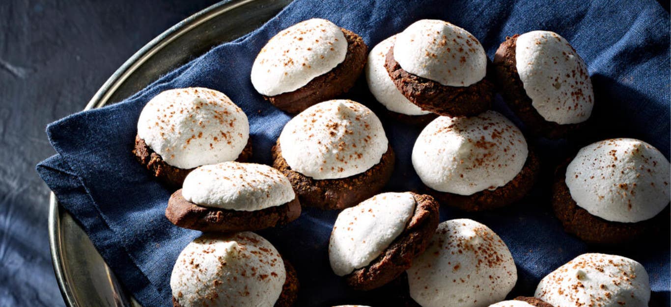 Chocolate Mint Kiss Cookies on a blue napkin on a silver serving tray