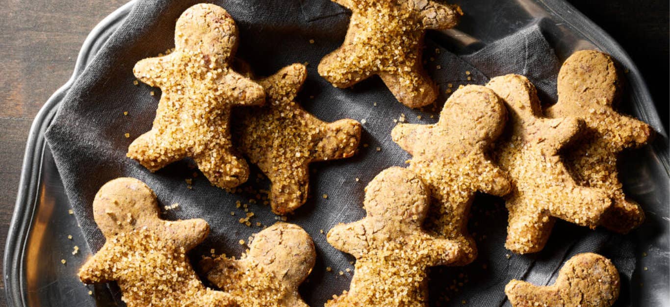 Vegan Gluten-Free Gingerbread Cookies on a dark blue linen cloth in a silver tray