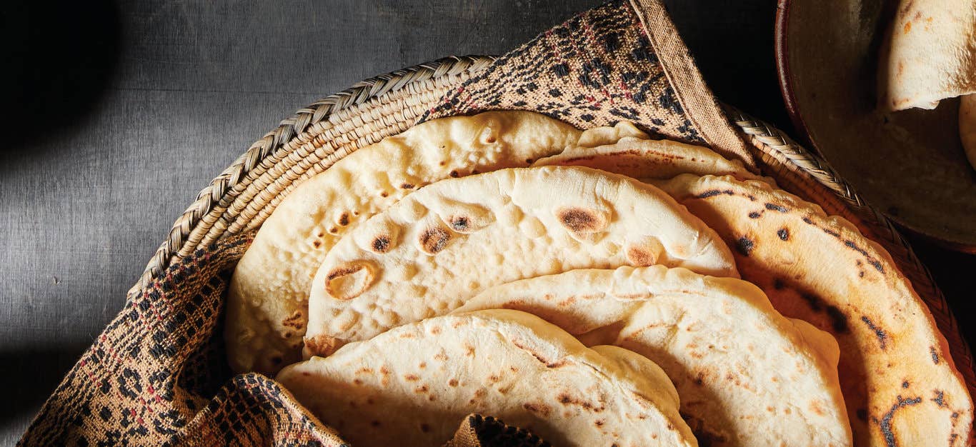 6 pieces of No-Fry Frybread on a cloth napkin in a woven plant-fiber bowl