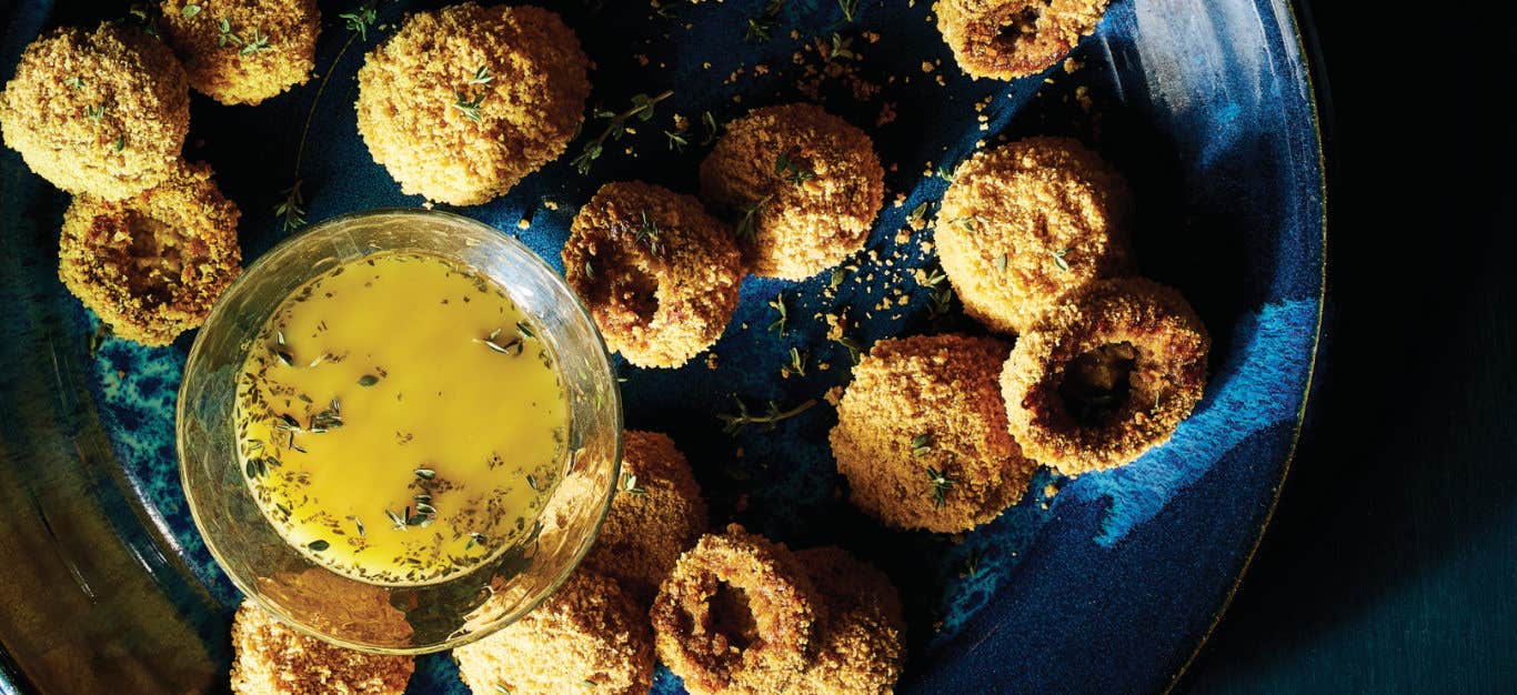 Breaded Mushrooms next to a small glass bowl of White Balsamic Vinaigrette