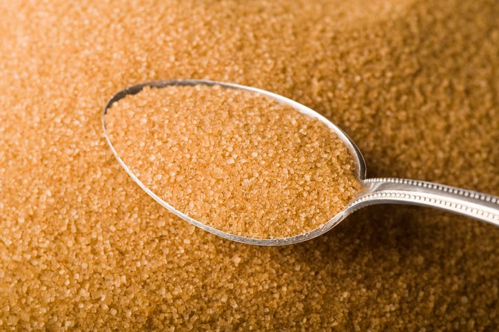 unrefined raw cane sugar in a spoon