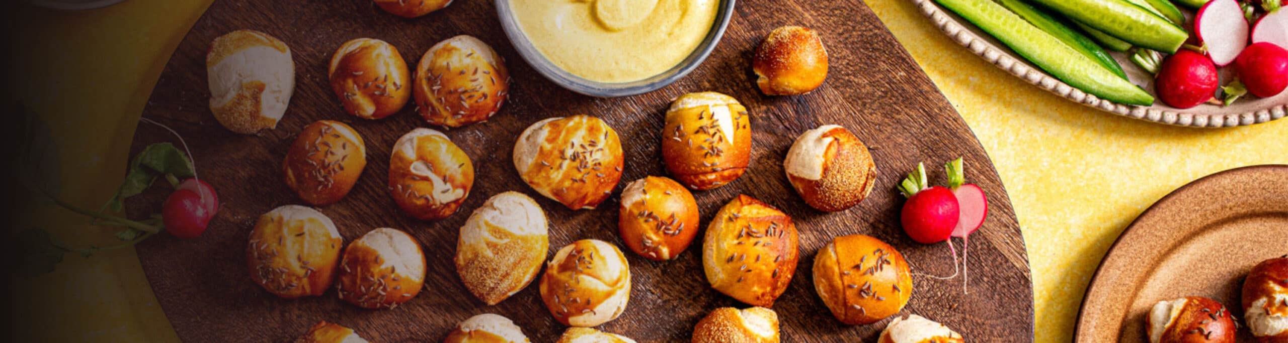 Whole Grain Pretzel Bites on a platter with mustard