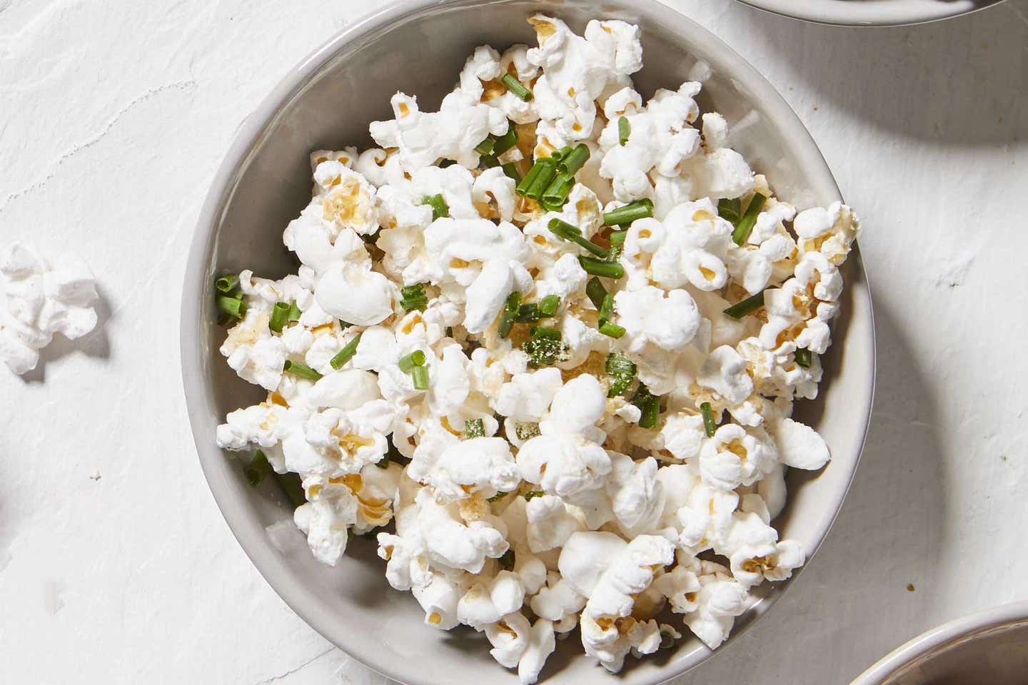 garlic and chive seasoned popcorn in a bowl