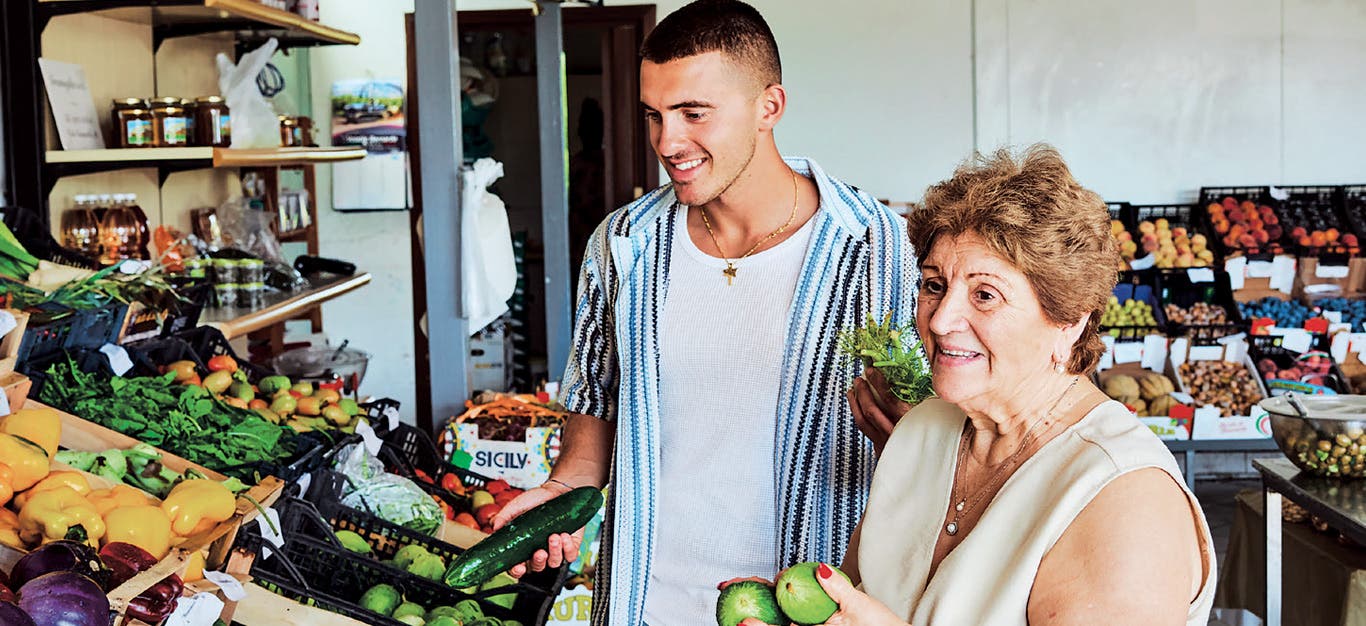 British-Italian TikToker Giuseppe Federici and his nonna Marianna shop for produce at an Italian market