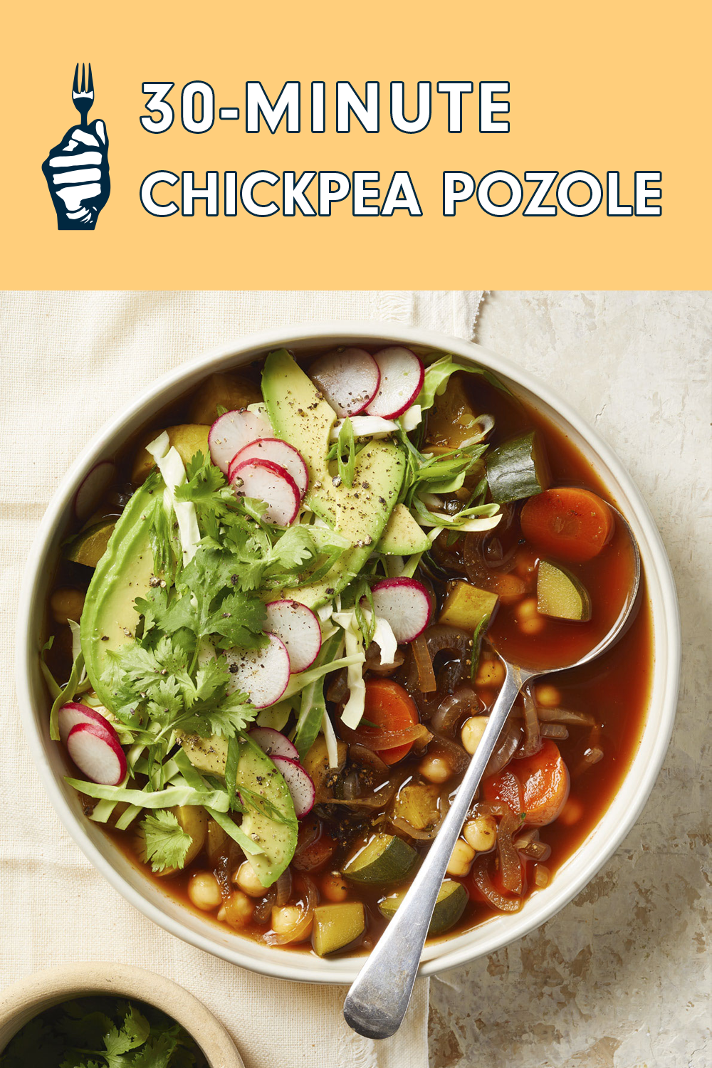 A bowl of vegan pozole garnished with radish slices, avocado, and cilantro. Text reads, "30-Minute Chickpea Pozole"