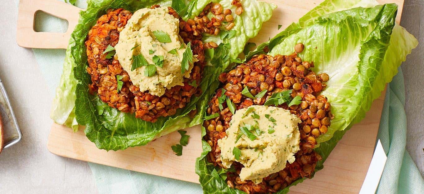 Lentil Burger Lettuce Wraps on a wood cutting board