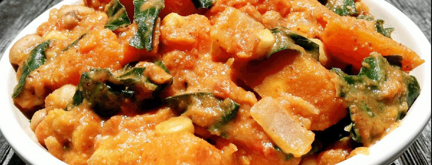 Close-up of African Yam Stew in a white bowl