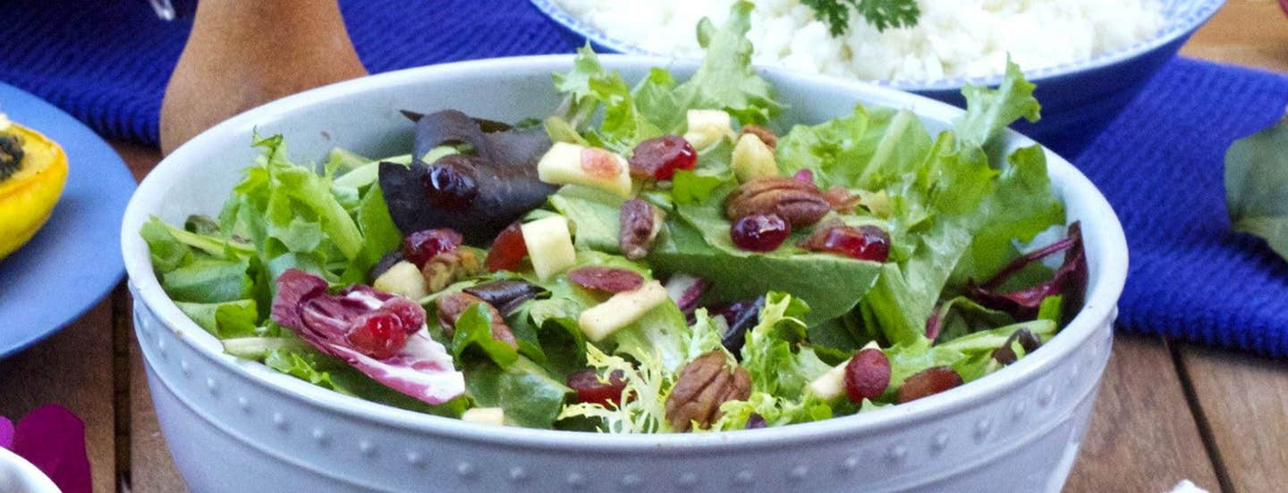 Autumn Mixed Greens Salad in a pale blue serving bowl