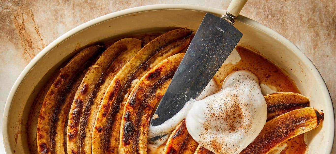 Healthy Vegan Bananas Foster with aquafaba whipped cream in a white casserole dish