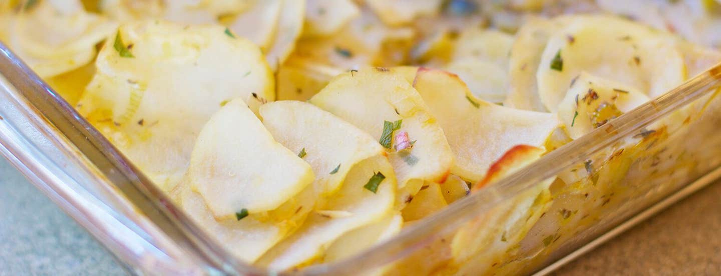 Boulangere Potatoes in a white casserole dish