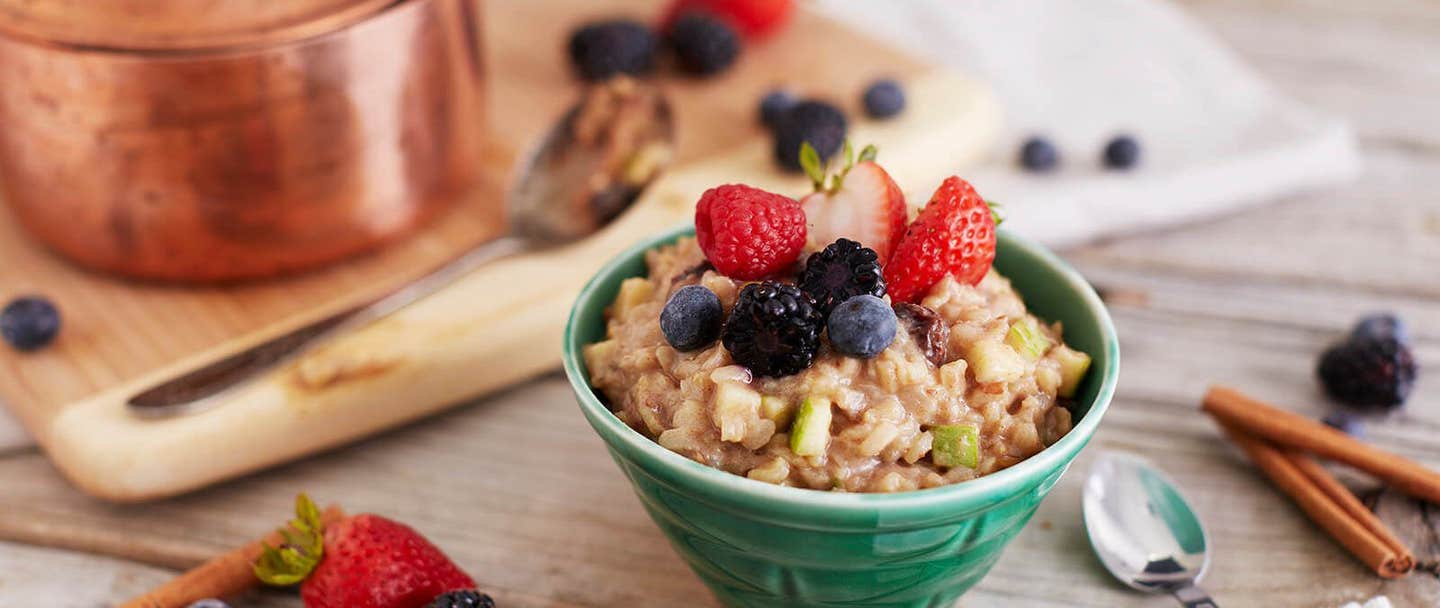 A bowl of brown rice pudding garnished with fresh berries