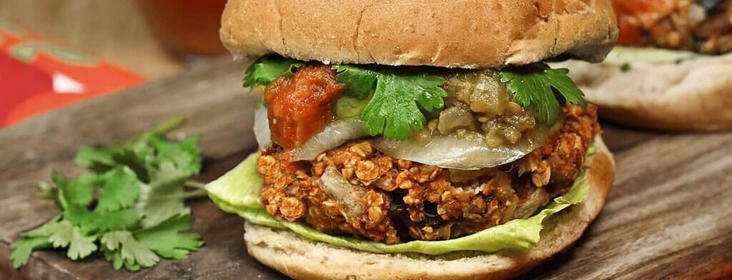 Mexican Veggie Burger and fresh cilantro on a wooden chopping board