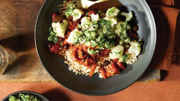 Zesty Chili Bowl with Cucumber-Mint Relish in a gray ceramic bowl with a metal fork