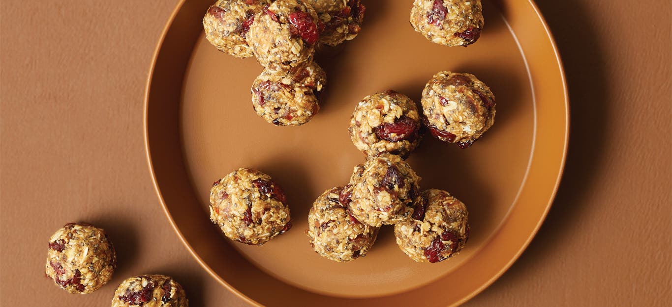 Cherry Oat Snack Balls on an orange plate