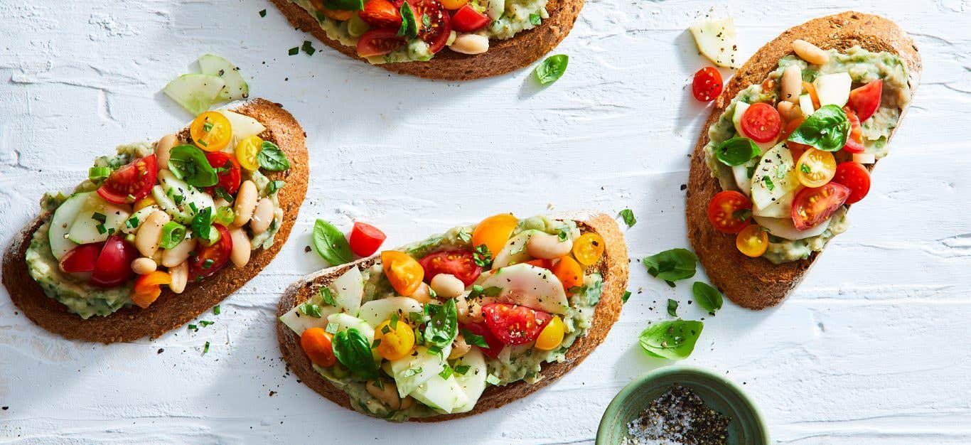 Cherry Tomato Bruschetta Tartines on a white countertop