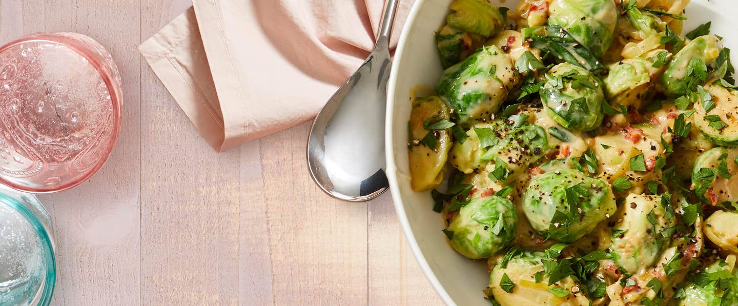 A bowl of Creamy Brussels Sprouts with sun-dried tomatoes