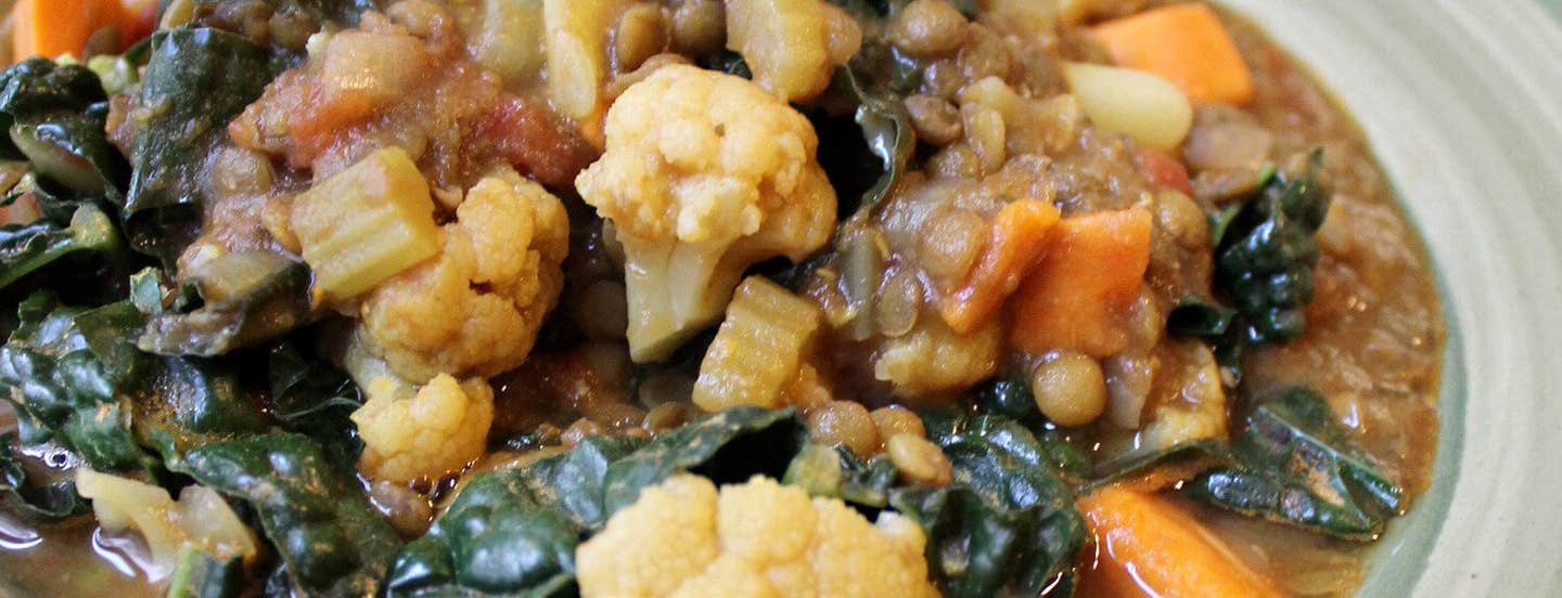 A close-up of Curried French Lentils with cauliflower and chard