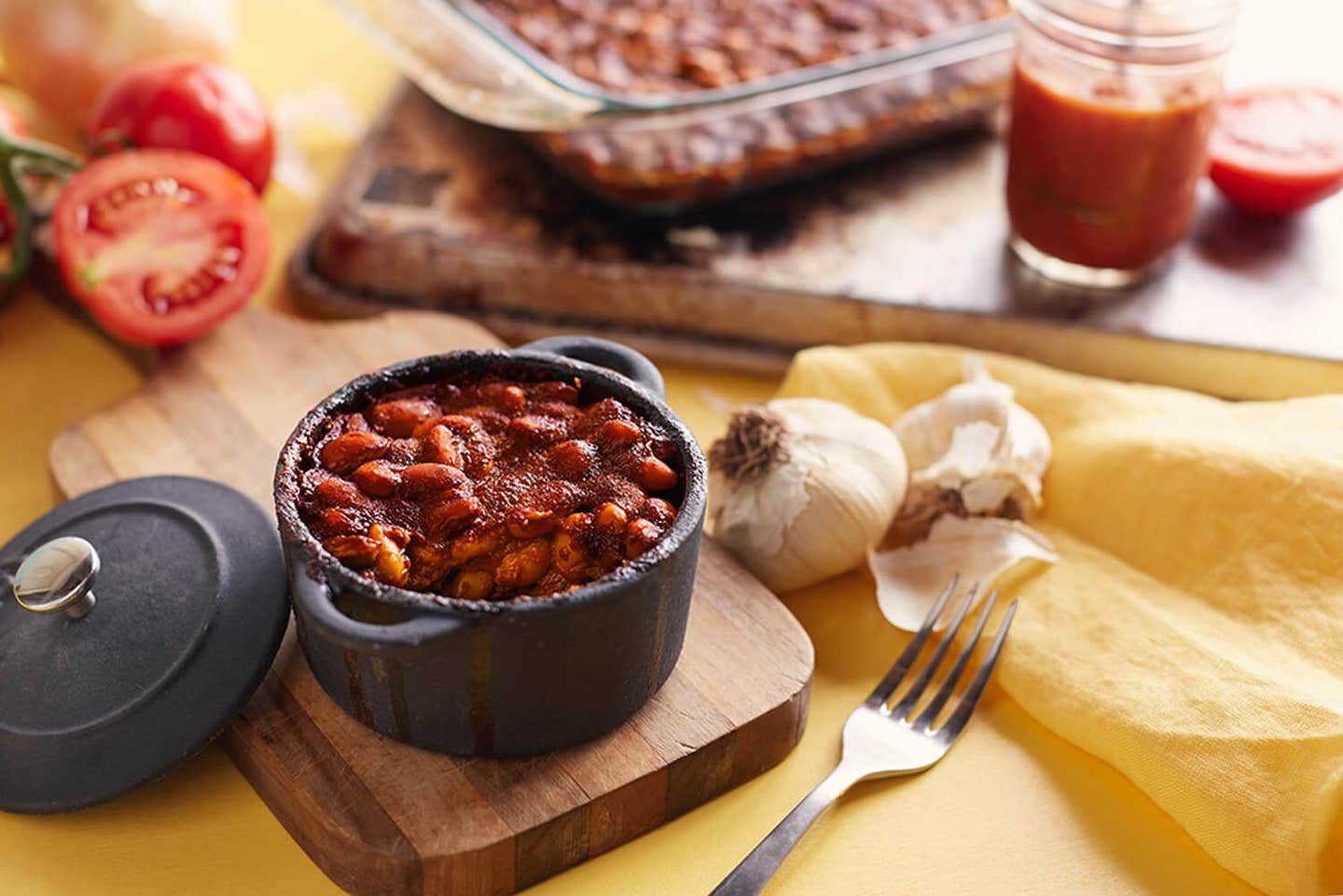 A single-serve cast-iron pot of homemade baked beans