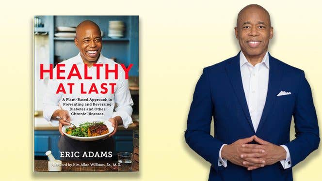 Eric Adams next to a copy of his book, "Healthy at Last"