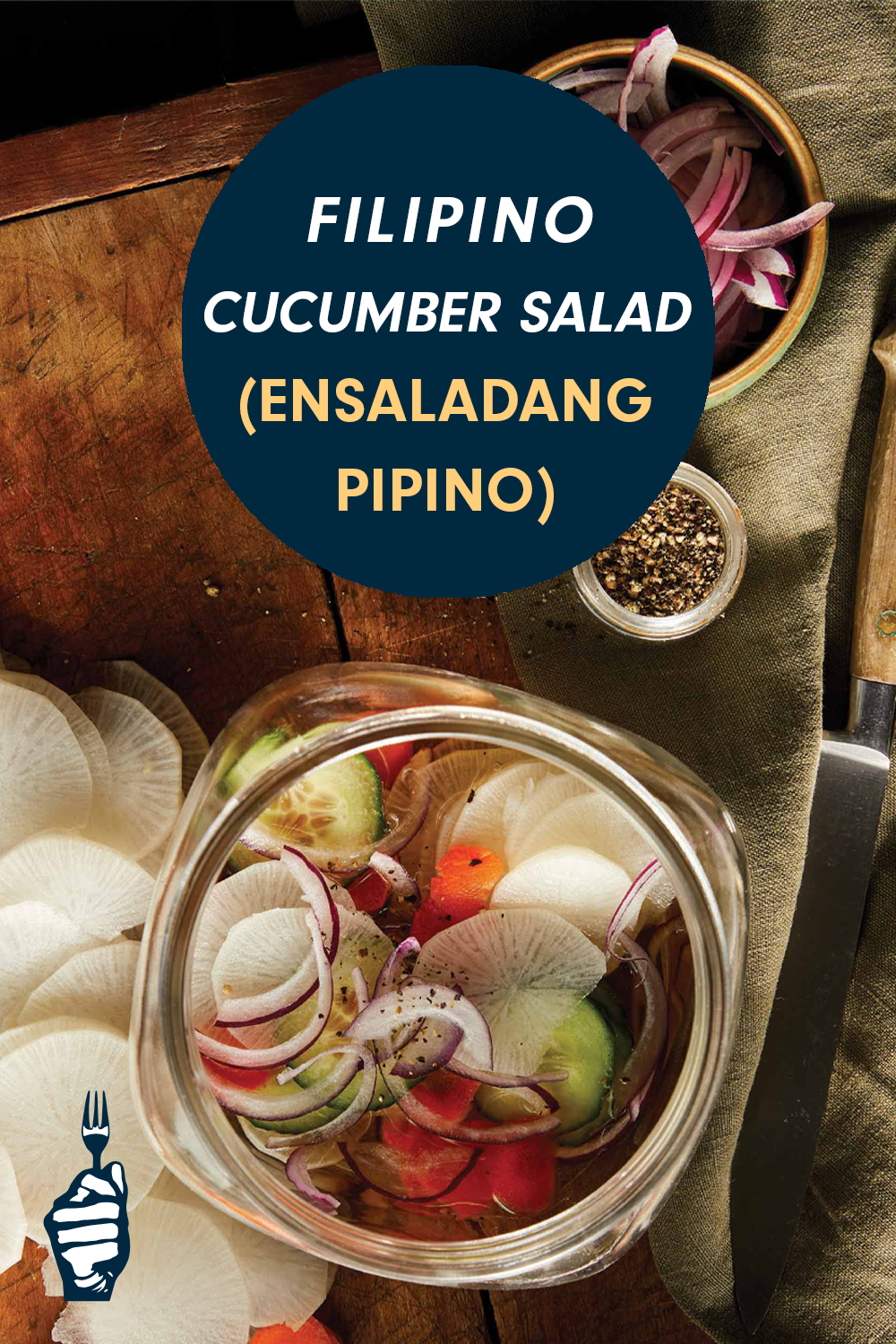 Looking down at a wide-mouthed jar of pickled veggies and a wooden chopping board. A text box reads, "Filipino Cucumber Salad (Ensaladang Pipino)"