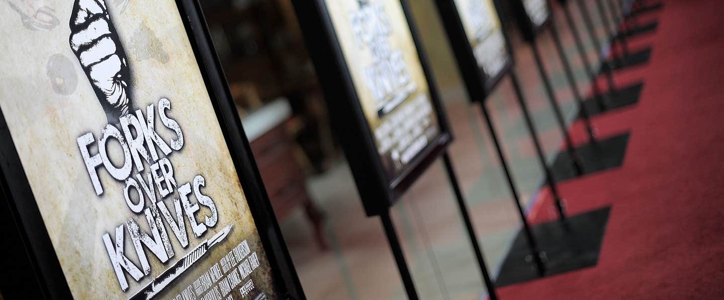 Red carpet lined with Forks Over Knives movie promo posters