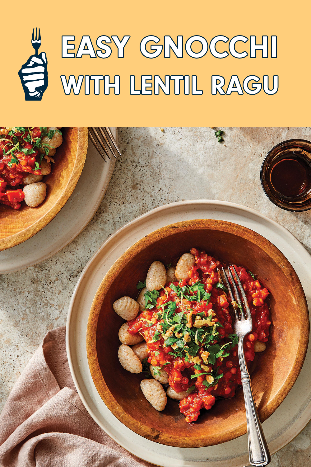 A delicious-looking bowl of gnocchi with a tomato-lentil sauce and a garnish of fresh herbs. Text reads, "Easy Gnocchi with Lentil Ragu"