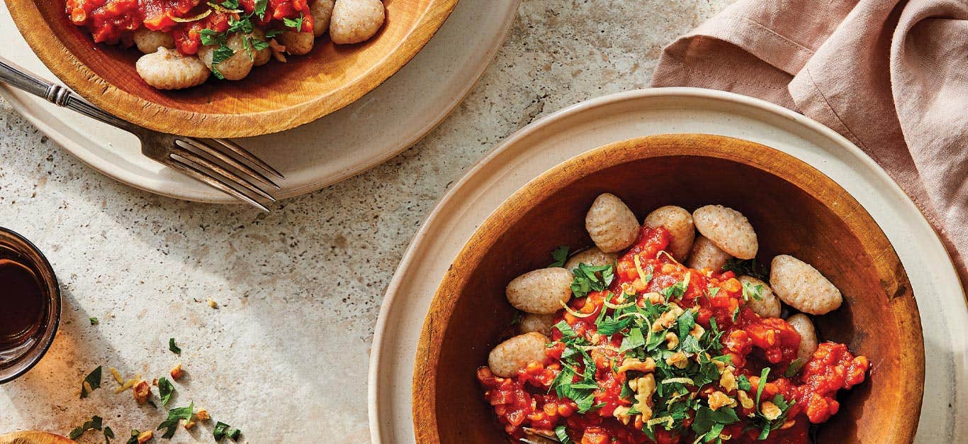 Easy Gnocchi with Lentil Ragu in orange ceramic bowls