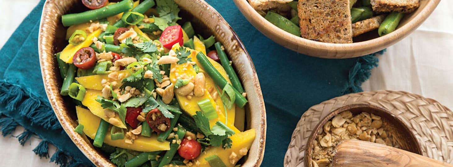 Green Bean and Mango Salad in a rustic, oval, ceramic serving bowl