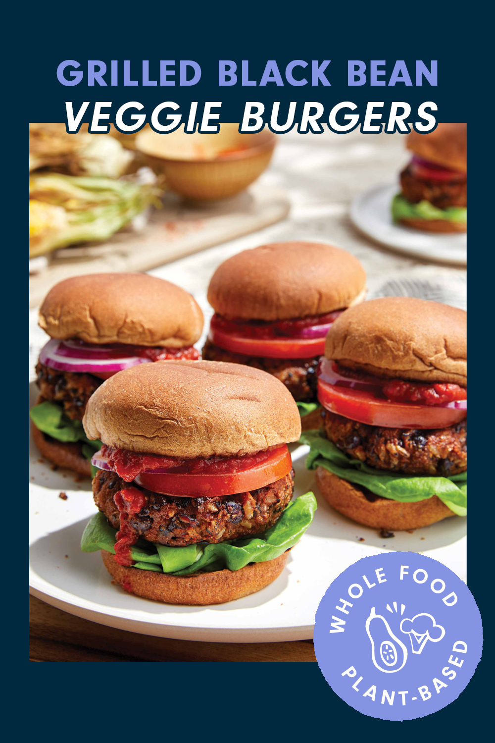 A plate of four veggie burgers on a round plate. A header at the top reads, "Grilled Black Bean Veggie Burgers"