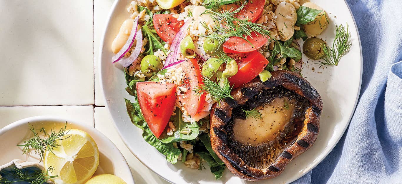 Gyro-Style Mushroom Steaks with Barley Salad on a white plate