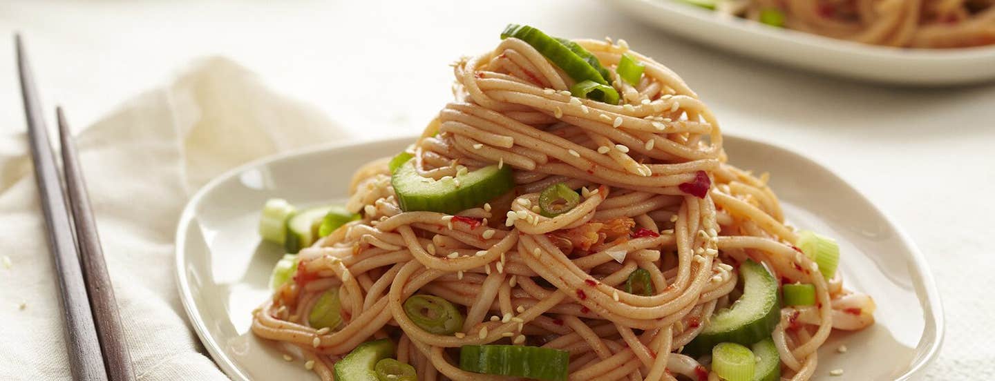 Kimchi Noodle Salad against a white background with chopsticks to the side