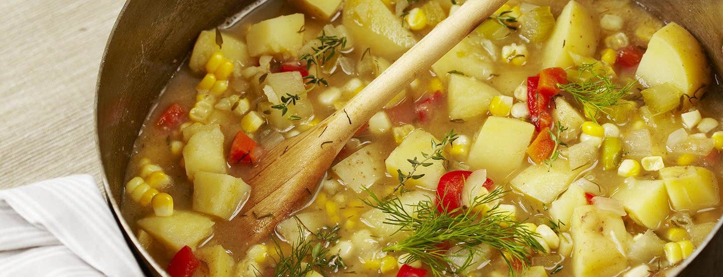 A closeup of Lotsa Vegetable Chowder in a large cooking pot