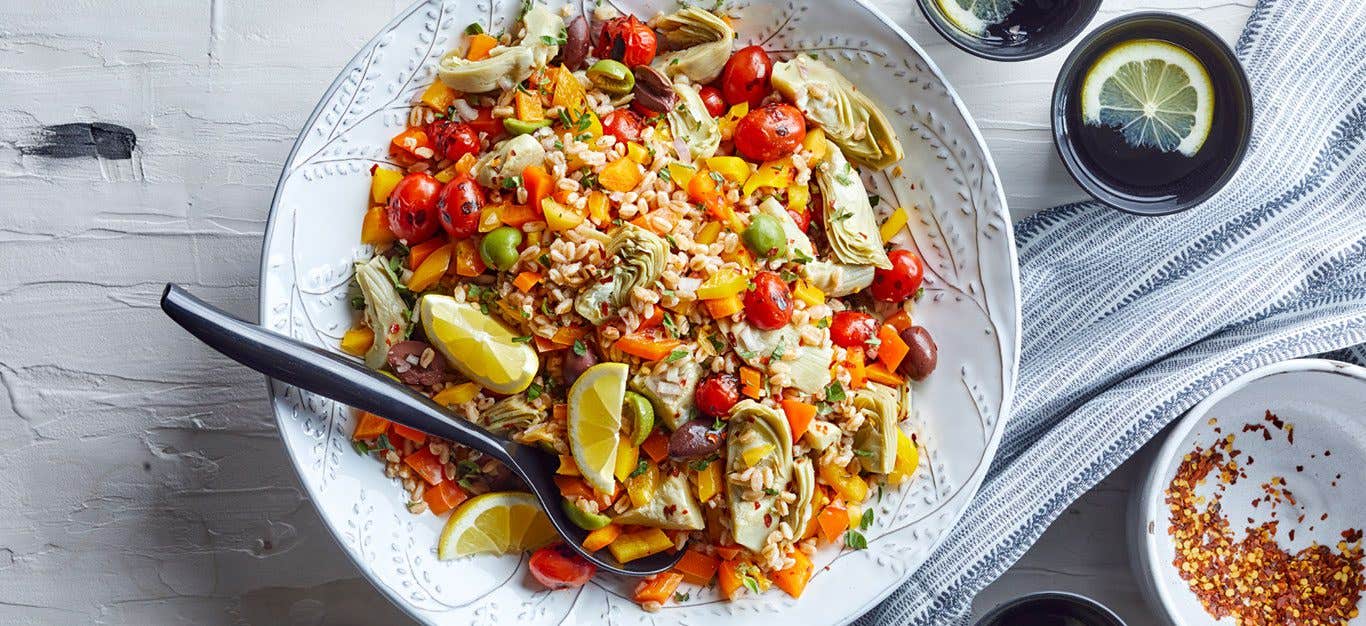 A Mediterranean farro grain salad with artichokes, tomatoes, and lemon