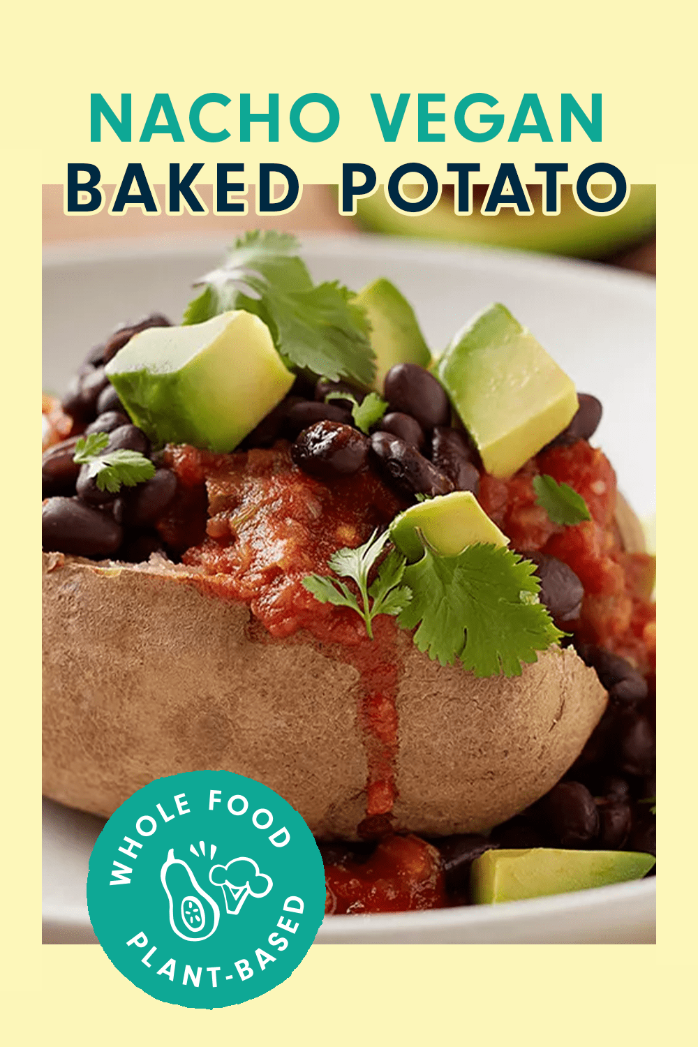 A baked potato topped with avocado, beans, and tomato sauce, with a text box, that reads, "Nacho" Vegan Baked Potato"