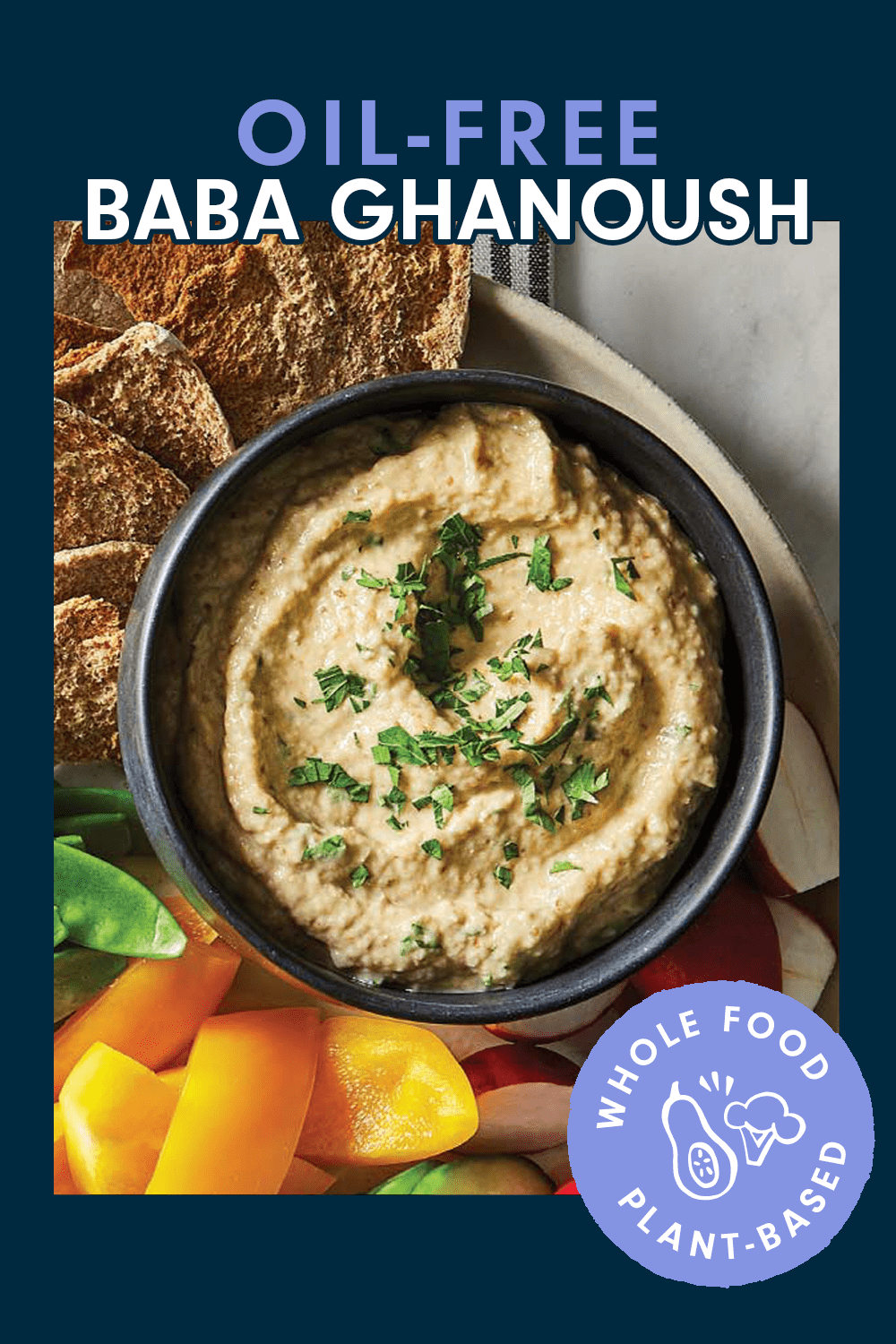 Oil-Free Baba Ghanoush on a plate with whole grain crackers, sugar snap peas, and yellow bell pepper