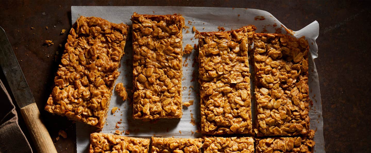 Peanut Butter Granola Bars on parchment paper on a baking tray